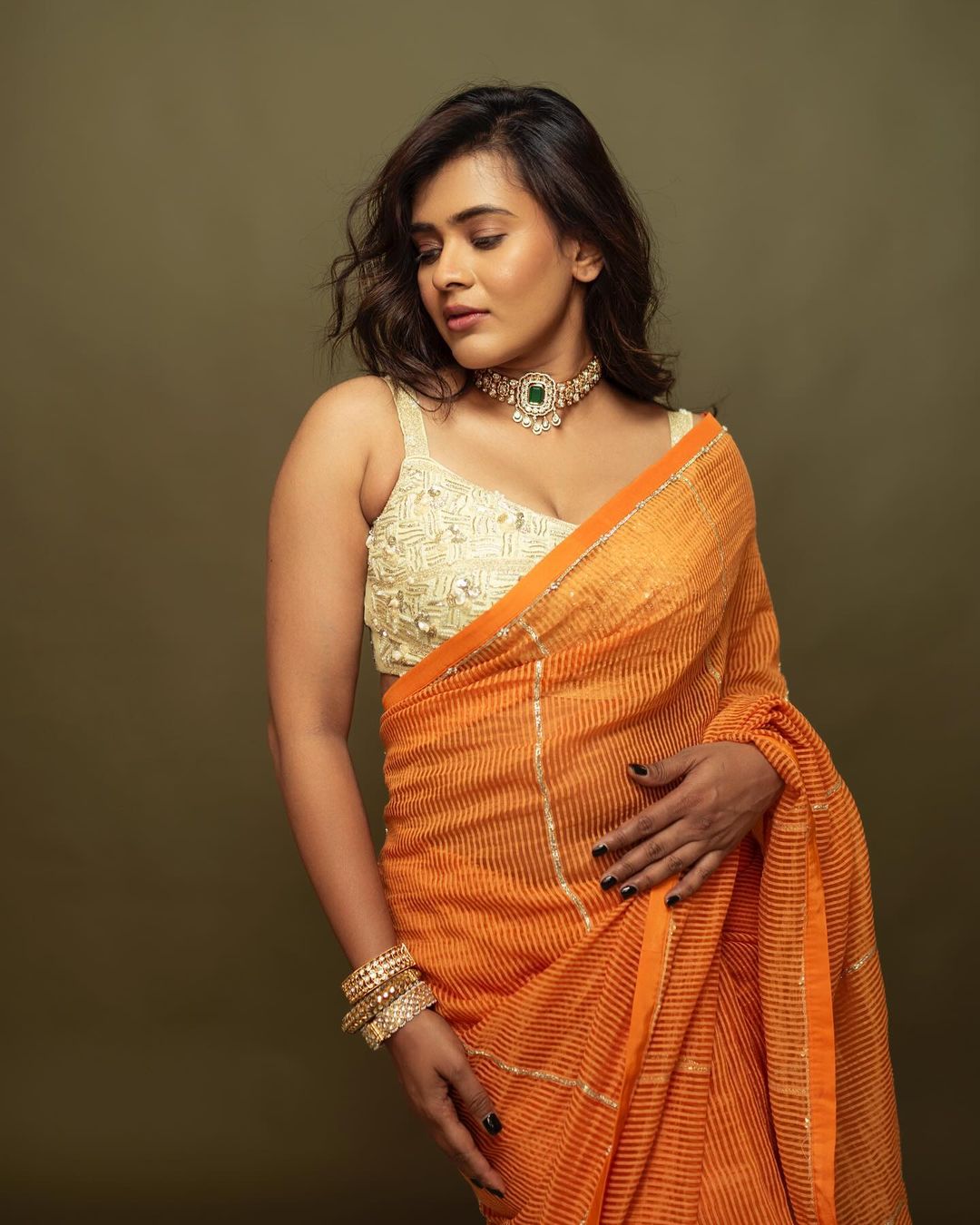 Indian Actress Hebah Patel Stills in Orange Saree